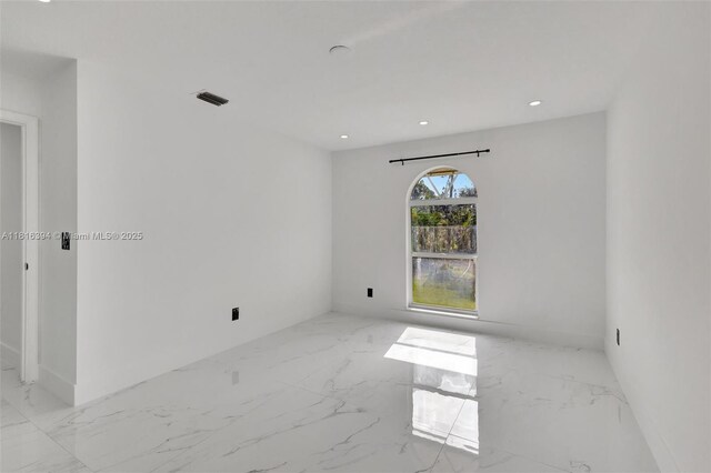17084 N 33rd Rd N, Loxahatchee, FL 33470 - unfurnished room with marble finish floors and recessed lighting