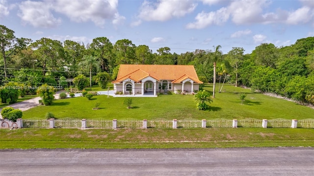 17084 N 33rd Rd N, Loxahatchee, FL 33470 - view of front facade featuring a tile roof and a forest view