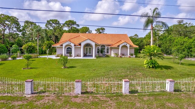 17084 N 33rd Rd N, Loxahatchee, FL 33470 - mediterranean / spanish-style house with a tiled roof and stucco siding