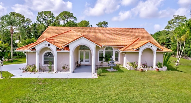 17084 N 33rd Rd N, Loxahatchee, FL 33470 - back of property featuring french doors, a tiled roof, stucco siding, and a lawn
