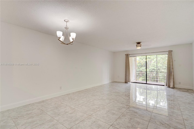 136 S Cypress Rd Unit 323, Pompano Beach, FL 33060 - unfurnished room with a chandelier, light tile patterned floors, baseboards, and a textured ceiling