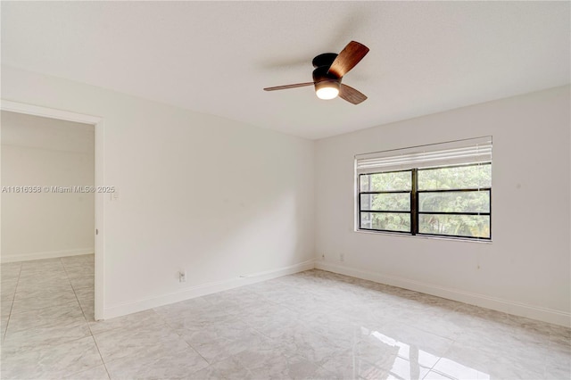 136 S Cypress Rd Unit 323, Pompano Beach, FL 33060 - empty room with a ceiling fan, light tile patterned floors, and baseboards