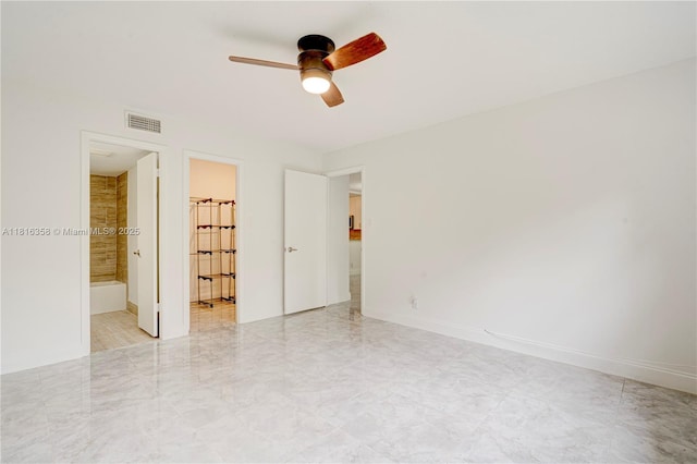 136 S Cypress Rd Unit 323, Pompano Beach, FL 33060 - unfurnished bedroom with connected bathroom, baseboards, and a ceiling fan