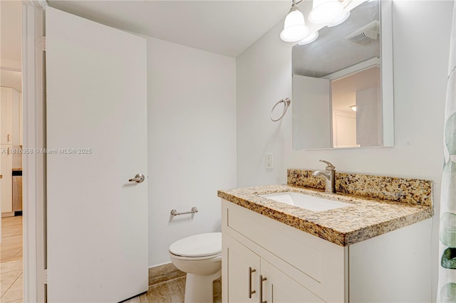 136 S Cypress Rd Unit 323, Pompano Beach, FL 33060 - bathroom featuring vanity, tile patterned floors, and toilet