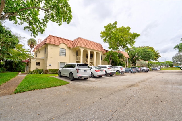 136 S Cypress Rd Unit 323, Pompano Beach, FL 33060 - view of building exterior with uncovered parking