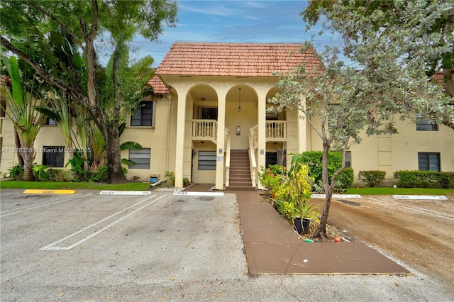 136 S Cypress Rd Unit 323, Pompano Beach, FL 33060 - view of building exterior with stairway and uncovered parking