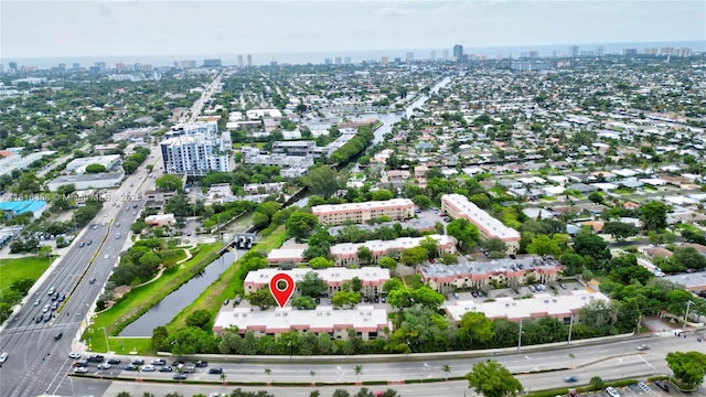 136 S Cypress Rd Unit 323, Pompano Beach, FL 33060 - aerial view of property and surrounding area featuring skyline, a highway, and a nearby body of water