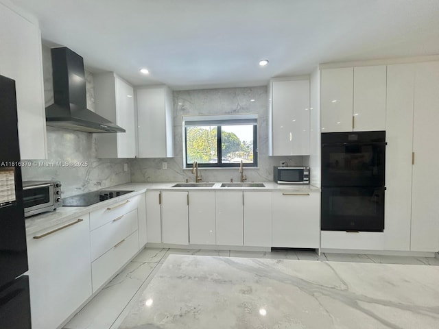 17630 NE 4th Ave, North Miami Beach, FL 33162 - kitchen with wall chimney range hood, black appliances, light marble finish floors, modern cabinets, and tasteful backsplash