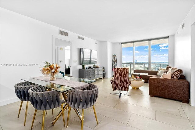 1800 S Ocean Dr Unit 2208, Hallandale Beach, FL 33009 - dining area with expansive windows and light tile patterned flooring