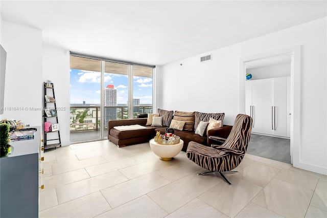 1800 S Ocean Dr Unit 2208, Hallandale Beach, FL 33009 - living room featuring expansive windows, light tile patterned flooring, and a city view