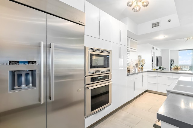 1800 S Ocean Dr Unit 2208, Hallandale Beach, FL 33009 - kitchen featuring appliances with stainless steel finishes, white cabinetry, modern cabinets, and light tile patterned flooring