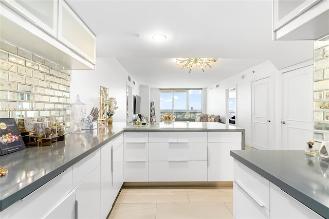 1800 S Ocean Dr Unit 2208, Hallandale Beach, FL 33009 - kitchen with white cabinets, light tile patterned floors, stainless steel countertops, and modern cabinets
