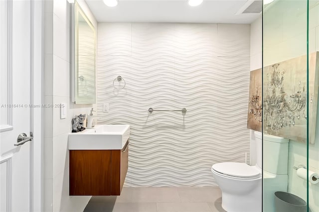 1800 S Ocean Dr Unit 2208, Hallandale Beach, FL 33009 - bathroom featuring vanity, tile walls, toilet, and tile patterned flooring