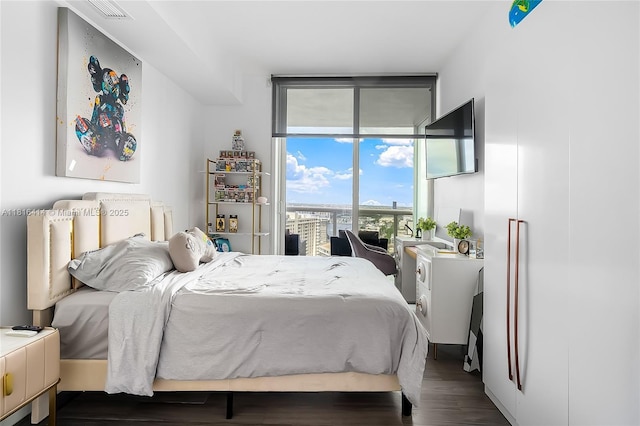 1800 S Ocean Dr Unit 2208, Hallandale Beach, FL 33009 - bedroom featuring dark wood-style flooring and expansive windows