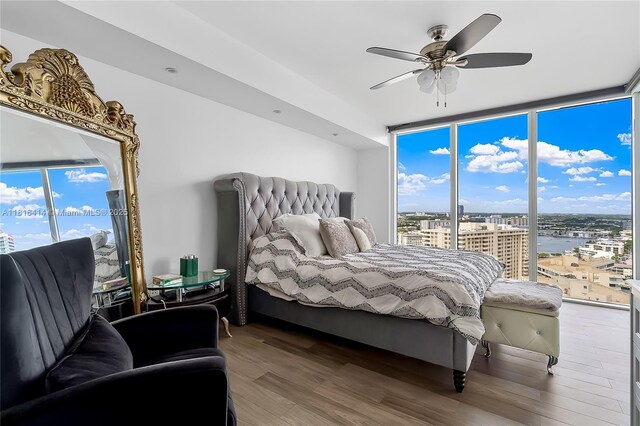 1800 S Ocean Dr Unit 2208, Hallandale Beach, FL 33009 - bedroom with wood finished floors, multiple windows, floor to ceiling windows, and a view of city