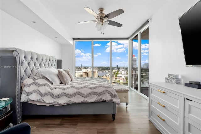 1800 S Ocean Dr Unit 2208, Hallandale Beach, FL 33009 - bedroom with floor to ceiling windows, access to exterior, wood finished floors, and a ceiling fan