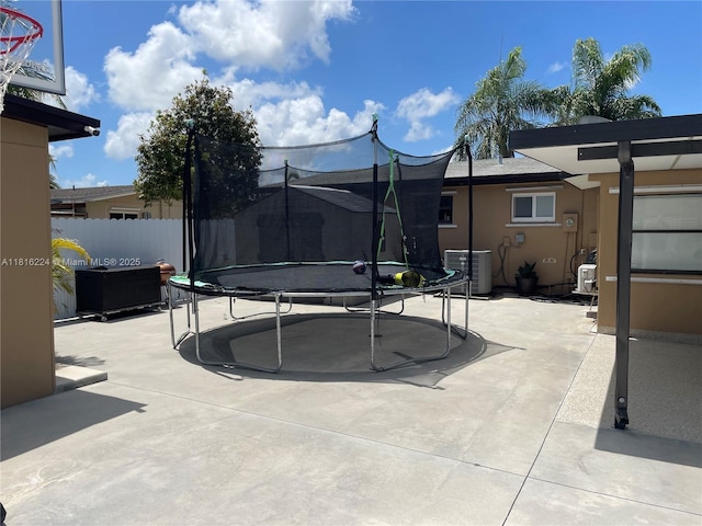 14511 SW 294th St, Homestead, FL 33033 - view of swimming pool with a trampoline, central AC, and a patio area