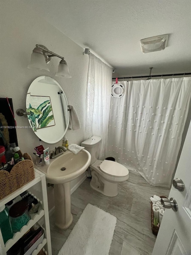 14511 SW 294th St, Homestead, FL 33033 - full bathroom with toilet, a shower with shower curtain, and a textured ceiling