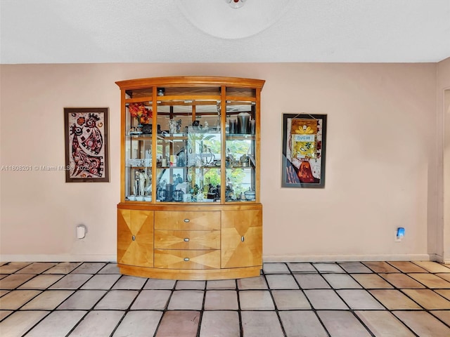 3121 N 52nd Ave, Hollywood, FL 33021 - unfurnished dining area featuring baseboards and light tile patterned floors
