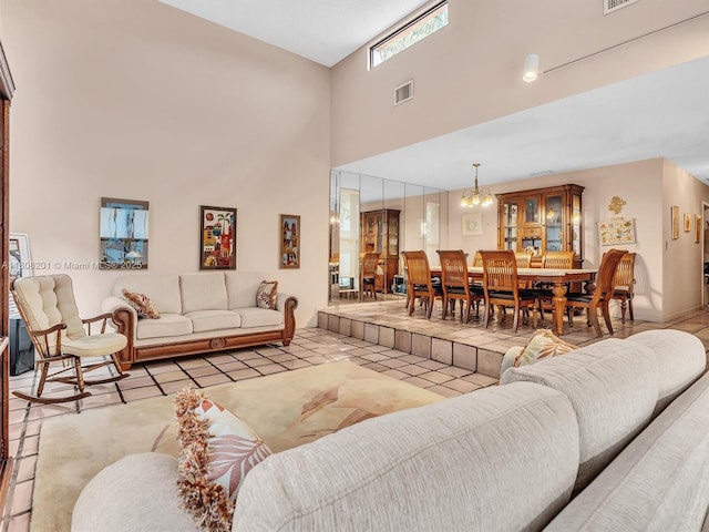 3121 N 52nd Ave, Hollywood, FL 33021 - tiled living area featuring a towering ceiling and a chandelier