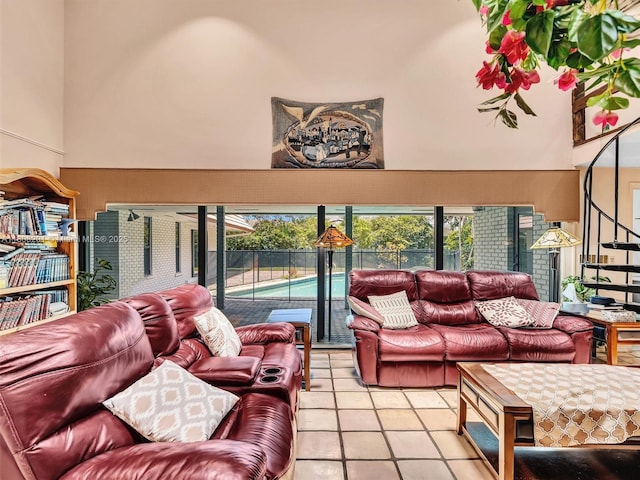 3121 N 52nd Ave, Hollywood, FL 33021 - living area featuring plenty of natural light, light tile patterned floors, and a high ceiling