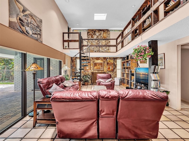 3121 N 52nd Ave, Hollywood, FL 33021 - living area with a high ceiling, tile patterned flooring, and stairway