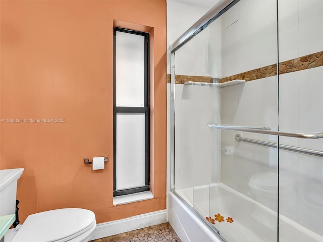 3121 N 52nd Ave, Hollywood, FL 33021 - bathroom featuring toilet, baseboards, and combined bath / shower with glass door