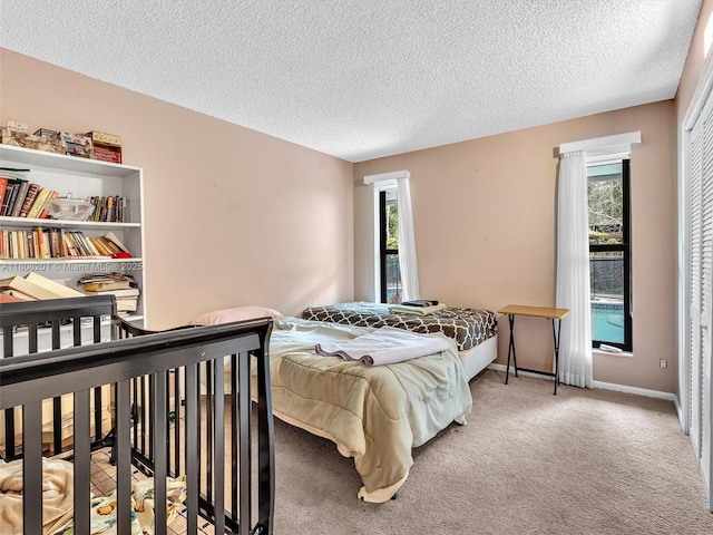 3121 N 52nd Ave, Hollywood, FL 33021 - carpeted bedroom with multiple windows and a textured ceiling