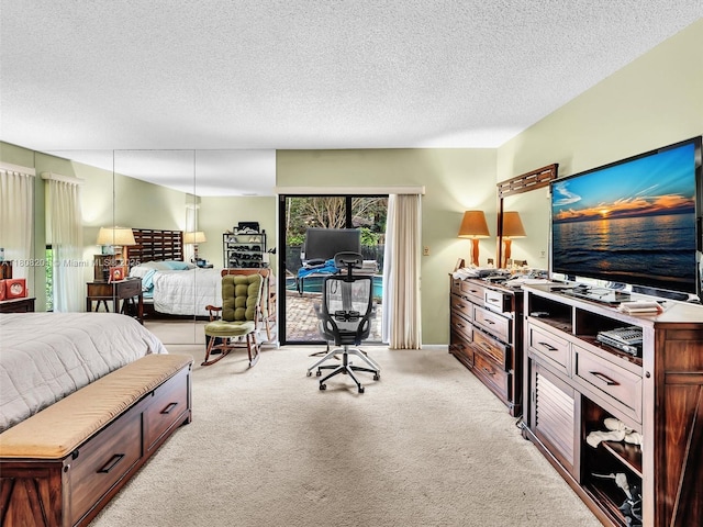3121 N 52nd Ave, Hollywood, FL 33021 - bedroom with access to exterior, light carpet, an office area, and a textured ceiling