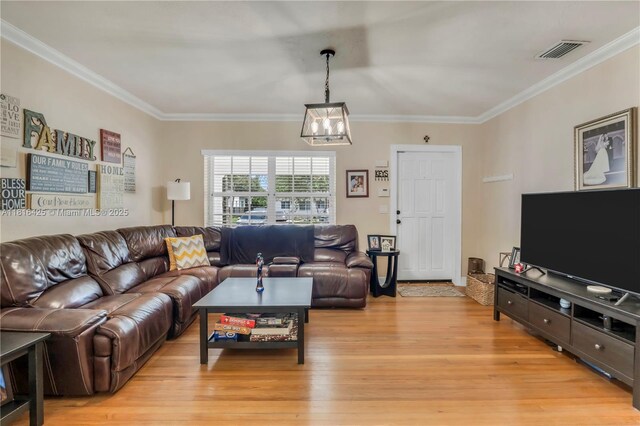 1110 Falcon Ave, Miami Springs, FL 33166 - living area featuring light wood-type flooring, a chandelier, and crown molding