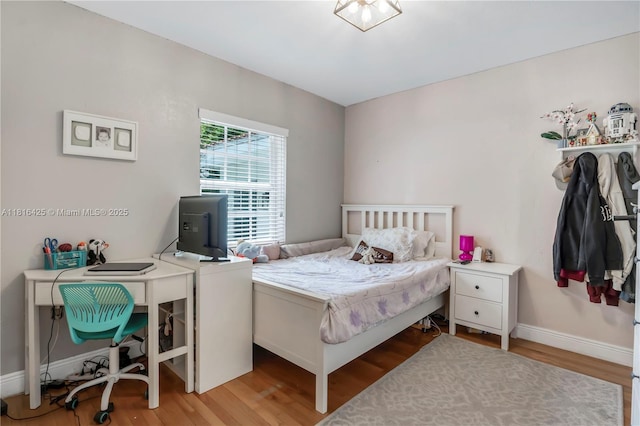 1110 Falcon Ave, Miami Springs, FL 33166 - bedroom featuring light wood-type flooring, baseboards, and a desk