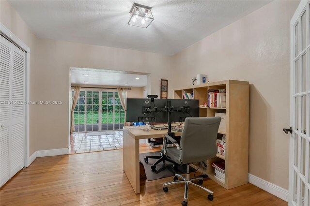 1110 Falcon Ave, Miami Springs, FL 33166 - office featuring hardwood / wood-style flooring and baseboards