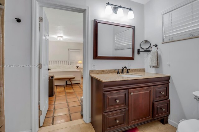 1110 Falcon Ave, Miami Springs, FL 33166 - bathroom with toilet, vanity, and tile patterned flooring