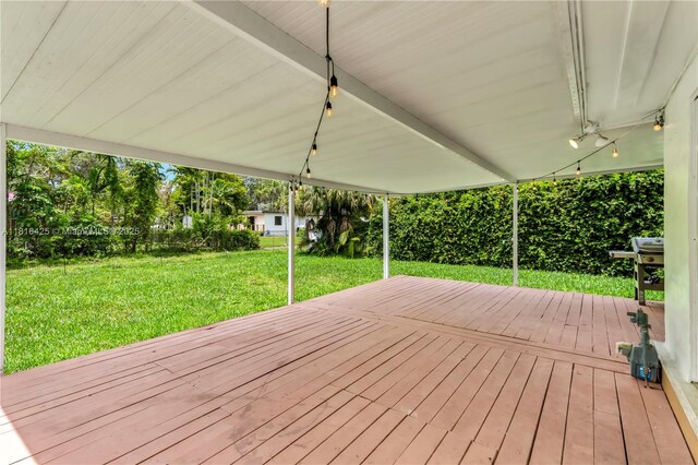 1110 Falcon Ave, Miami Springs, FL 33166 - wooden deck with a lawn
