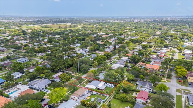 1110 Falcon Ave, Miami Springs, FL 33166 - aerial perspective of suburban area featuring property parcel outlined