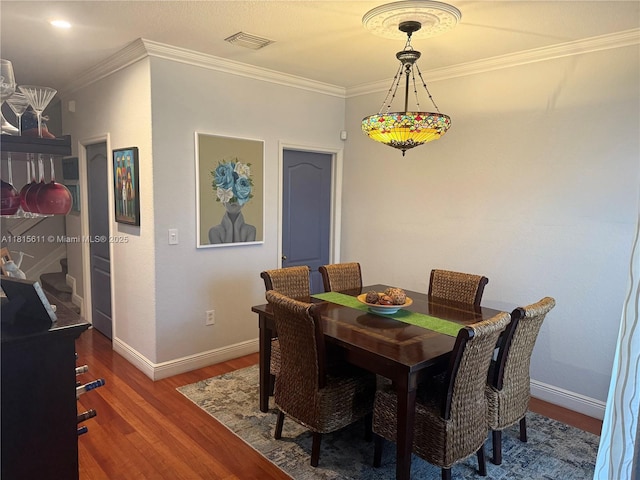 973 SW 149th Ct, Miami, FL 33194 - dining room featuring wood finished floors, ornamental molding, and baseboards