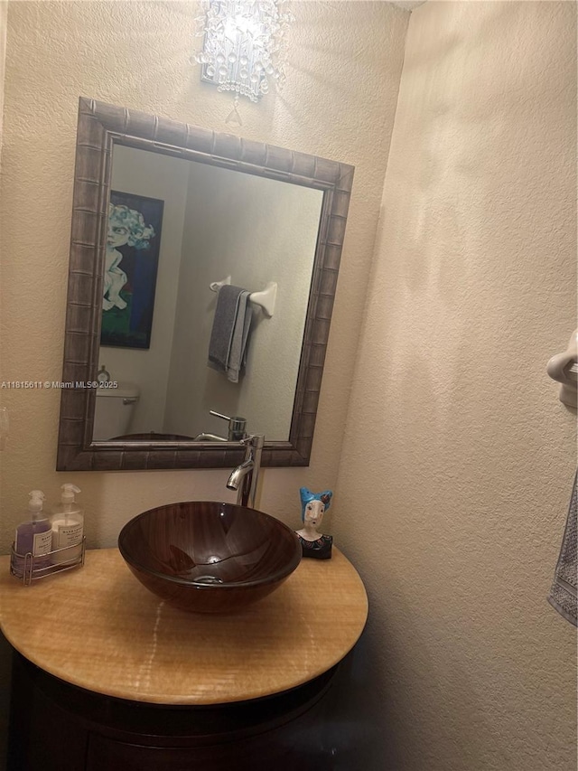 973 SW 149th Ct, Miami, FL 33194 - bathroom with a textured wall and vanity