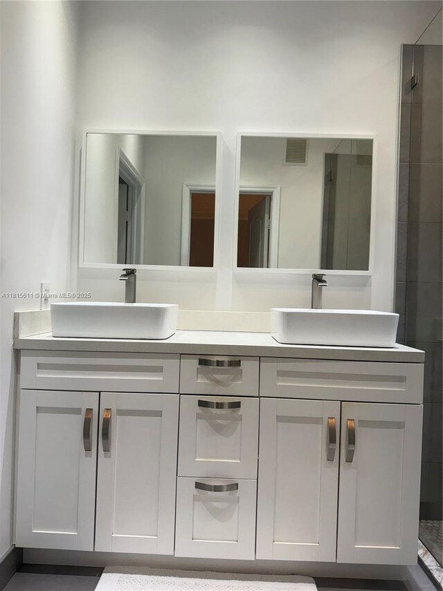 973 SW 149th Ct, Miami, FL 33194 - bathroom featuring double vanity and a tile shower