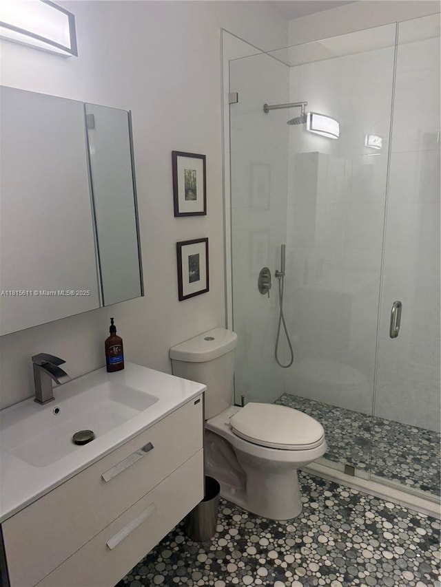973 SW 149th Ct, Miami, FL 33194 - bathroom featuring a stall shower, vanity, toilet, and tile patterned flooring