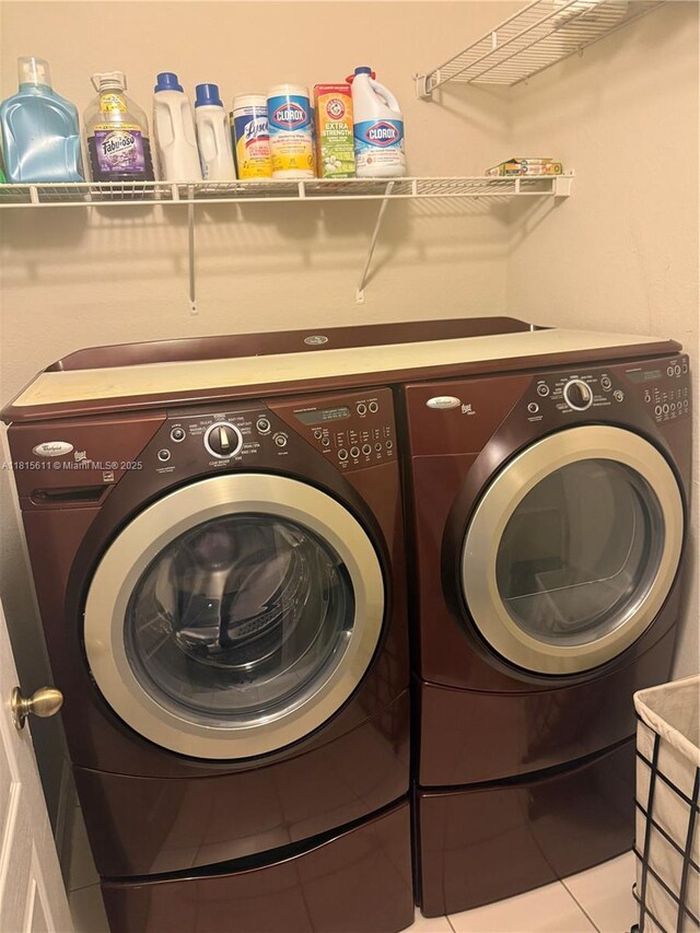 973 SW 149th Ct, Miami, FL 33194 - laundry room featuring washing machine and clothes dryer and tile patterned floors