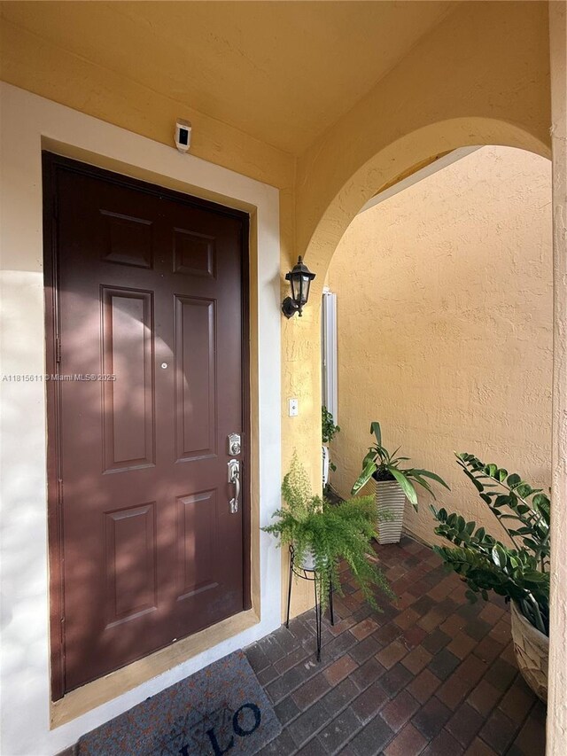 973 SW 149th Ct, Miami, FL 33194 - doorway to property with stucco siding