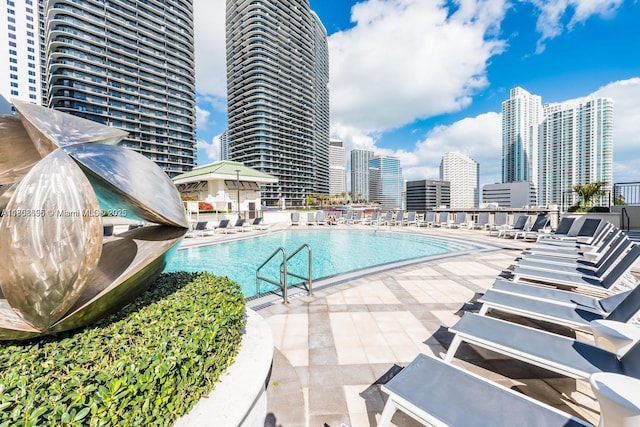 999 1st Ave Unit 2707, Miami, FL 33130 - community pool featuring a view of skyline and a patio