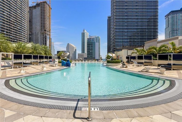 999 1st Ave Unit 2707, Miami, FL 33130 - community pool featuring a city view and a patio