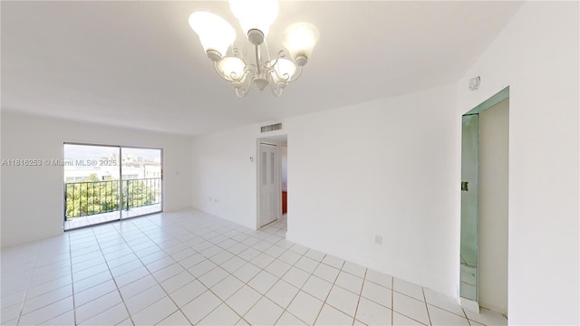 677 SW 9th Ave Unit 309, Miami, FL 33130 - empty room featuring a chandelier and light tile patterned floors
