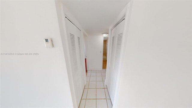 677 SW 9th Ave Unit 309, Miami, FL 33130 - corridor featuring light tile patterned floors and baseboards