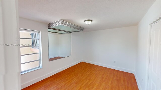 677 SW 9th Ave Unit 309, Miami, FL 33130 - empty room featuring light wood-style flooring and baseboards