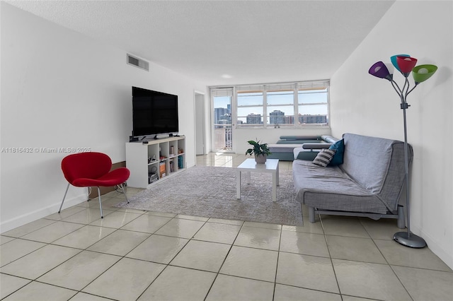 251 174th St Unit 2115, Sunny Isles Beach, FL 33160 - living room featuring baseboards and tile patterned floors