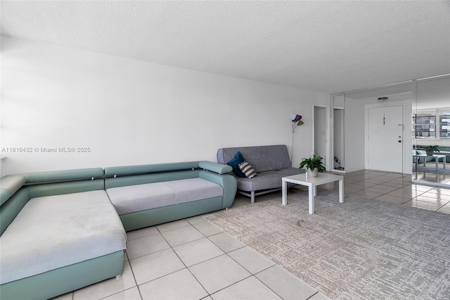 251 174th St Unit 2115, Sunny Isles Beach, FL 33160 - living room featuring tile patterned floors and a textured ceiling