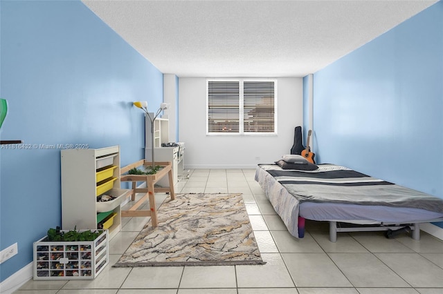 251 174th St Unit 2115, Sunny Isles Beach, FL 33160 - bedroom with a textured ceiling, tile patterned floors, and baseboards