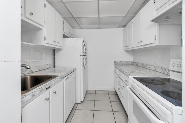251 174th St Unit 2115, Sunny Isles Beach, FL 33160 - kitchen with white appliances, white cabinets, light countertops, a paneled ceiling, and a sink